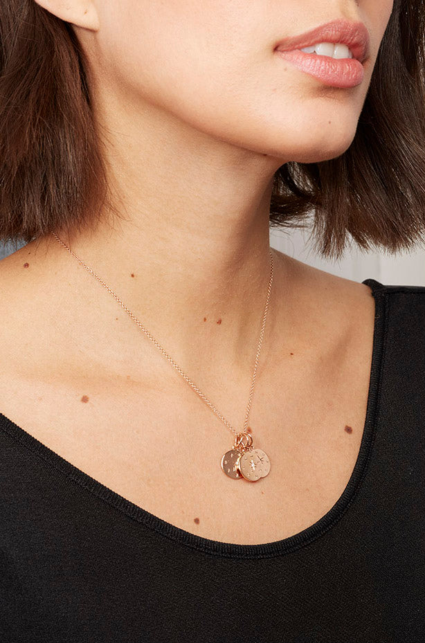 Birthstone charm-diamond necklace on neck